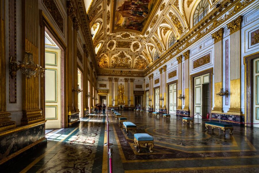 Campania: Royal Palace of Caserta Guided Private Tour - Meeting beneath the flags at Piazza Carlo di Borbone