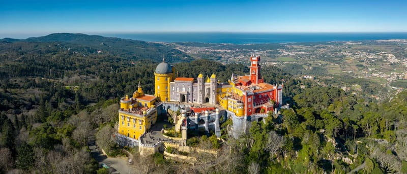 Lisbon: Pena Palace, Sintra, Cabo da Roca & Cascais Day Trip - Pickup from Lisbon and the ride into Sintra
