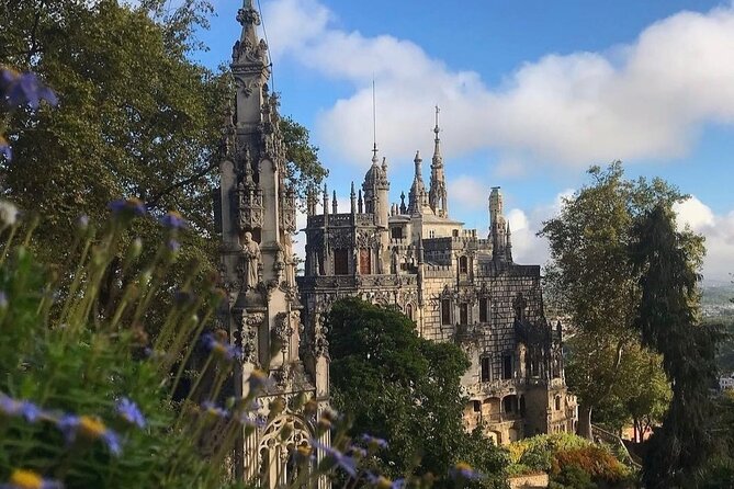 Lisbon: Sintra, Pena Palace, Regaleira, Roca & Cascais Day Tour - Monserrate Palace from the road