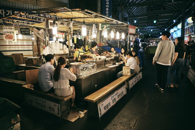 Seoul Night Palace & Market Food Tour with Vehicle - Walking through Seoul toward Jogyesa Temple