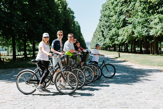 Versailles Domain Bike Tour with Palace Entry by Train from Paris - Biking through Versailles’ royal grounds